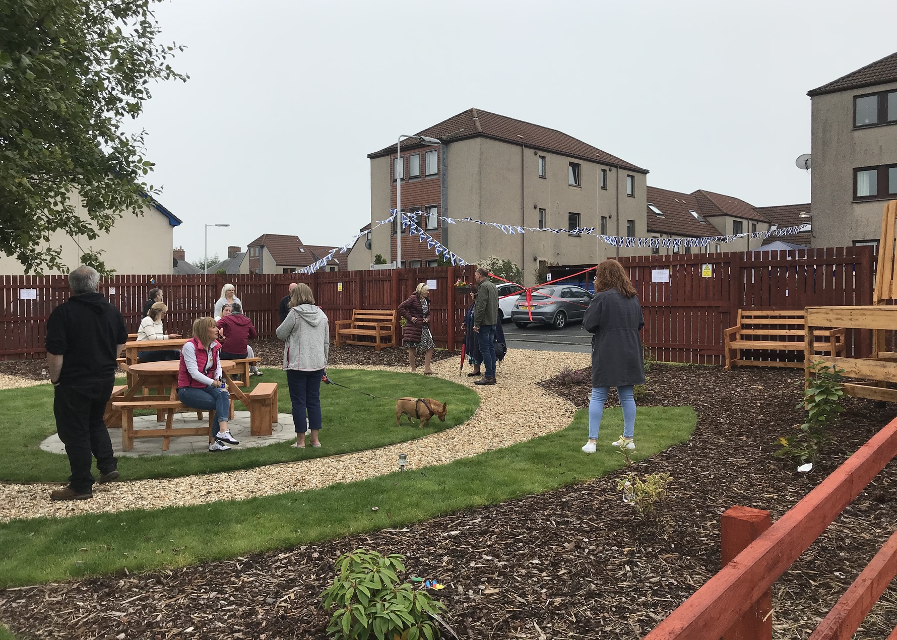 a group of people hanging out in the garden